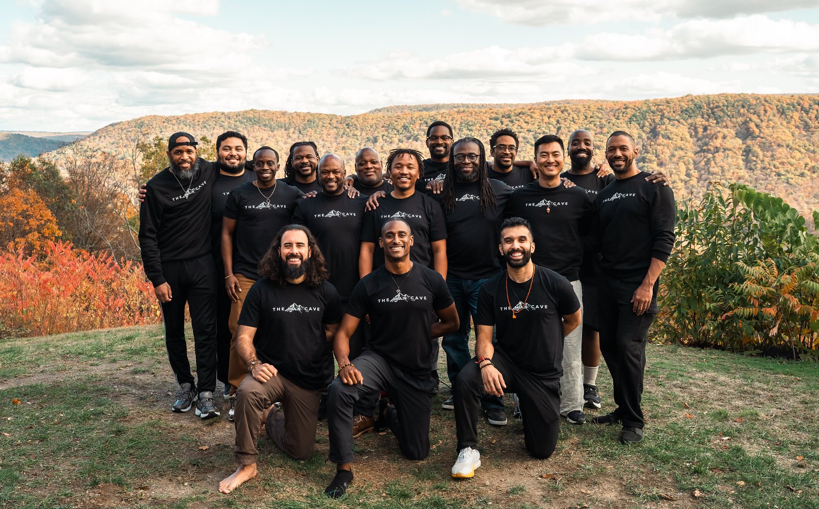 The Man Cave brotherhood together on a mountain overlook in autumn